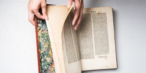 picture of hand turning a page in a book