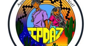 IPDAZ 2022 logo. Artwork by Taylor, a Tohono O’odham artist. A male and female Indigenous figure bordered by a basket with the words IPDAZ between them.