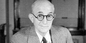 Portrait of Senator Carl. T. Hayden, seated at a desk with pen in hand. Ca. 1935.