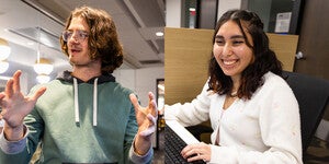 Two students, one talking and gesturing and one sitting at a computer typing on a keyboard and looking at a screen