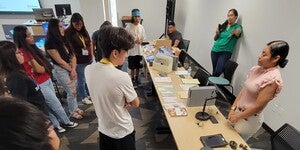 Students in classroom learning about archives