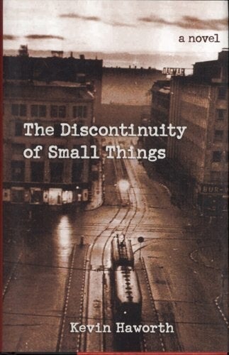 Cover of "The Discontinuity of Small Things" featuring a vintage photograph of an empty city street