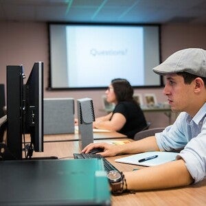 A student doing research online using a computer