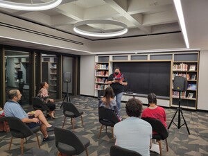 Taté Walker (Lakota citizen of the Cheyenne River Sioux Tribe of South Dakota) read their poetry at Labriola's Open Mic. 