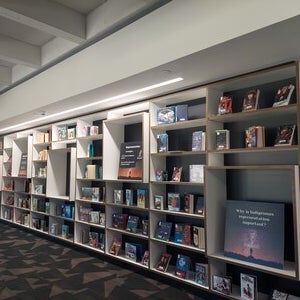 Image of Office of Indian Education Book Display with Indigenous childrens and young adult literature throughout shelves in Labriola Center's new space at Hayden library.