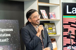 Director Alex Soto at front of podium for Grand Opening