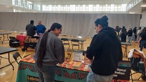 Students reviewing the Graphic novels from the Labriola Center table at ASU RECHARGE