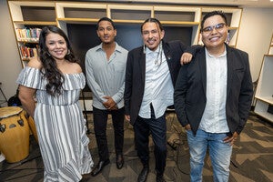 From left to right: Earth Surface People Performers Sydney Marian on vocals, Israel Solomon on congas, Dakota Yazzie on guitar and vocals, and Michael Gutierrez on sax