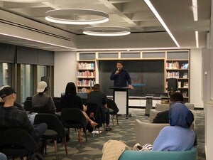 Photo of Jake Skeets leading the Indigenous Open Mic Night