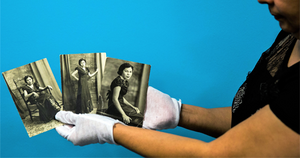 Community Archivist showing photos from her collection