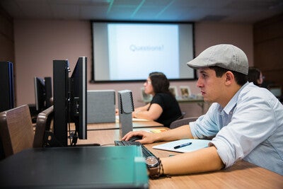 student working at a computer