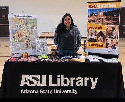 Alexis Juarez stands at the ASU Library student orientation booth