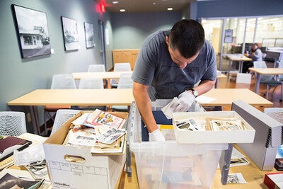 Students preparing the ASU Library maker studio set.