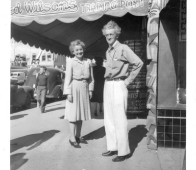 Black and white photo of Fred Wilson with his wife, Ruth Wilson standing in front of their trading post