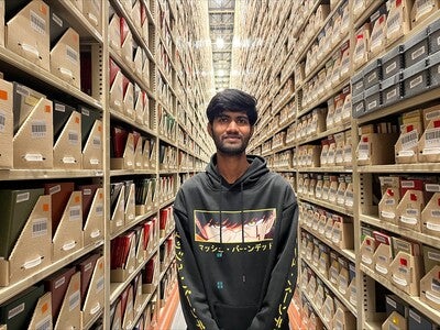 Portrait of Harianth Kalavala in an aisle at High Density Collections